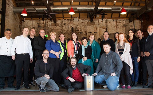 Eric Sidoti as Chair of the Parramatta Campus Life Committee, joined by the committee pictured with the 25th anniversary time capsule which was placed in the Boilerhouse 2014