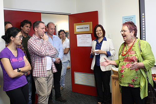 Zoe Sofoulis speaks at Ien Ang's farewell morning tea with Ien and ICS staff and students looking on.