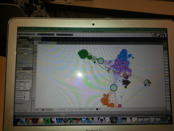 Gephi mapping videos on YouTube on laptop screen.