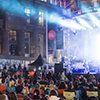 Thumbnail image of outdoor concert. 