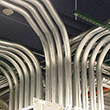 Thumbnail image of large cables in a data centre.