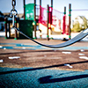 Thumbnail image of a swing in a playground 
