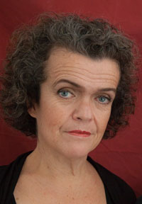 portrait photograph of a woman with short curly hair