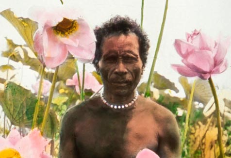 Vaieki Igo standing among lotus flowers on Lake Murray, Western Province, November 1922