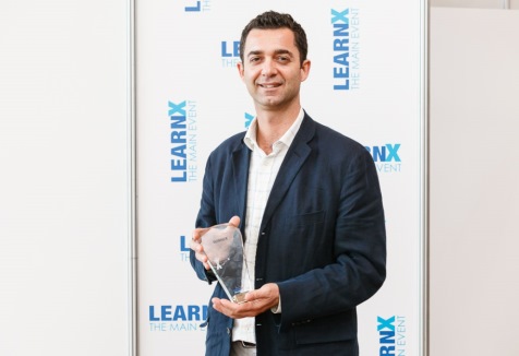 Con Athanasiou with his award