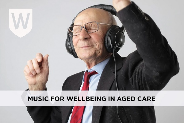 Elderly man dancing while listening to music