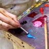 Hand holding paintbrush  