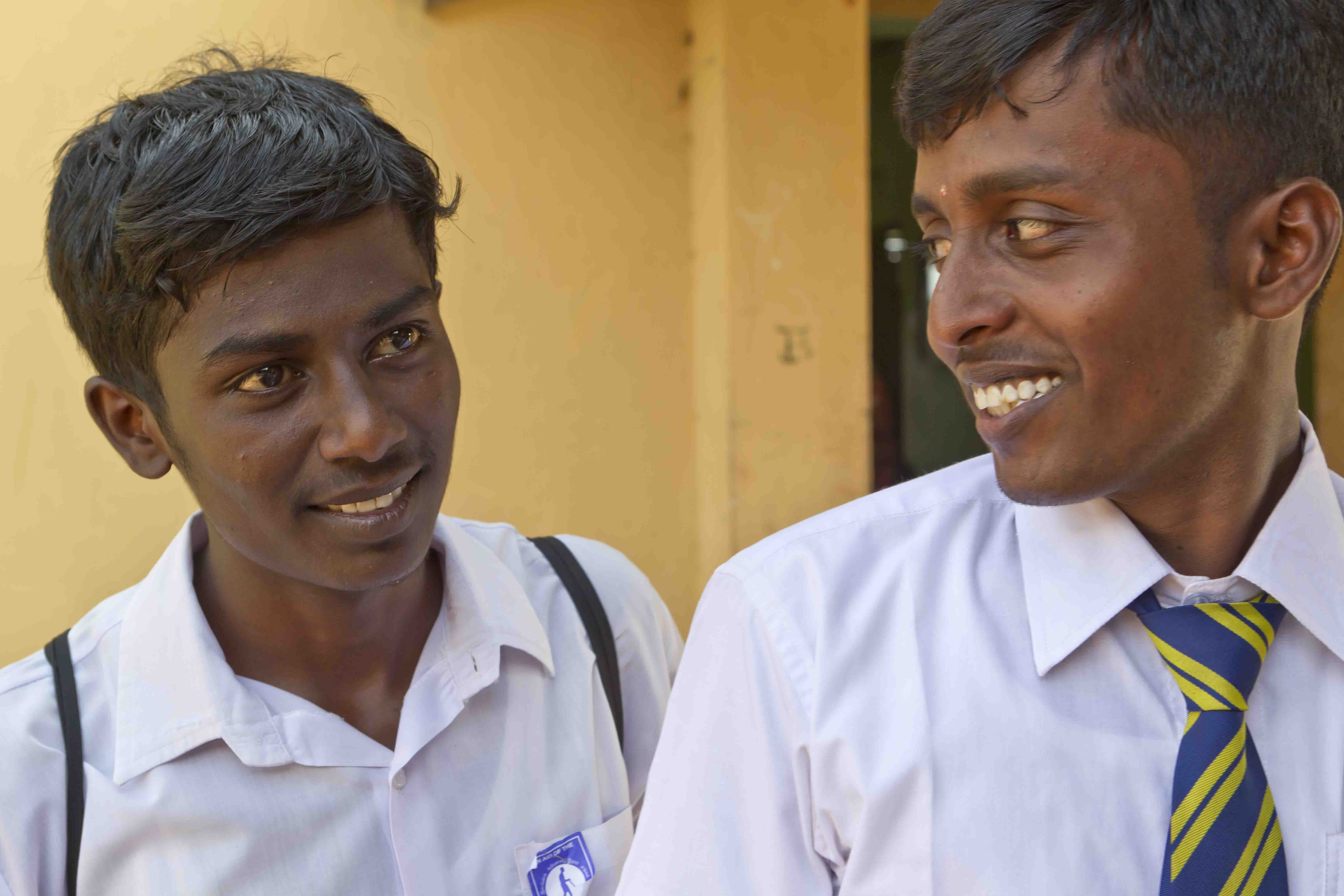 Two young men wearing school uniform 