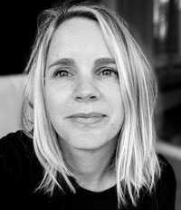 Black and white portrait photograph of a white woman with fair hair