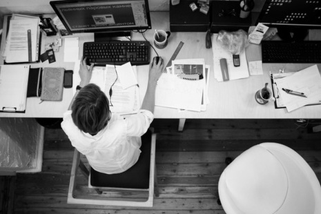 Black and White Overhead Photo of Person Working at Desk with Computer