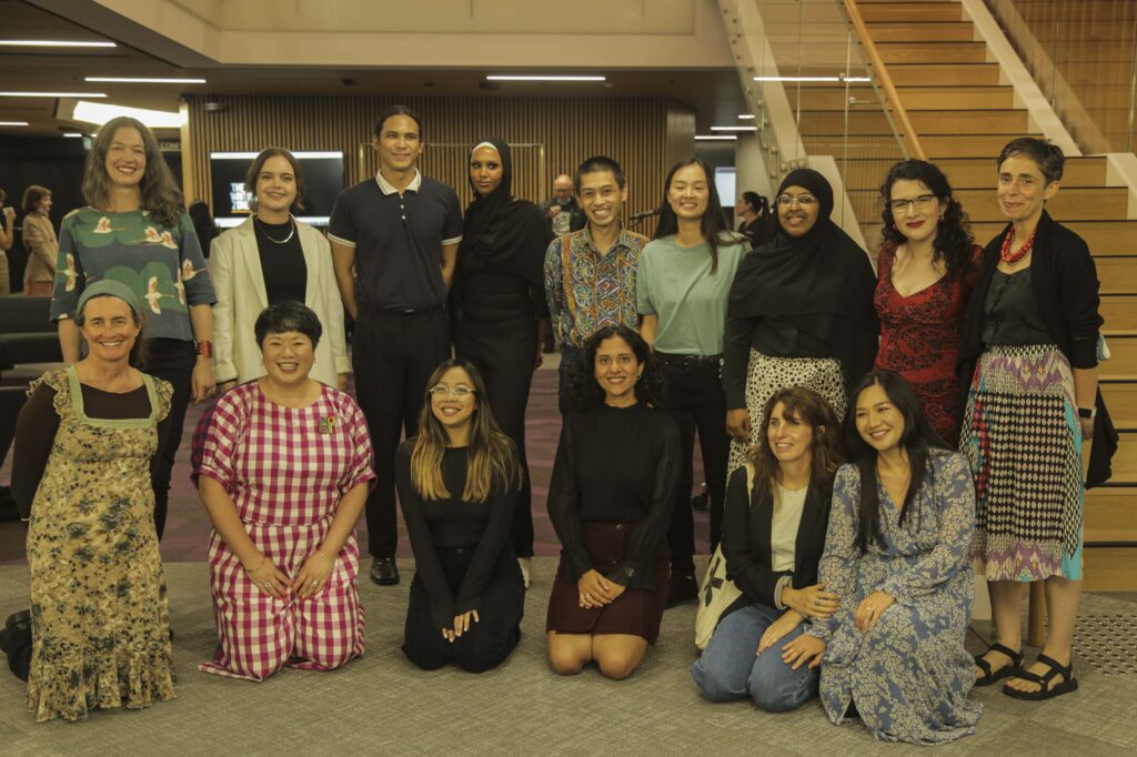 Writing Zone cohort. A group of writers smile at the camera.