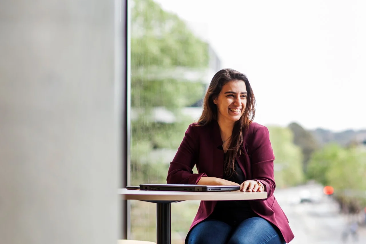 Students at a table on campus,Student at a table on campus