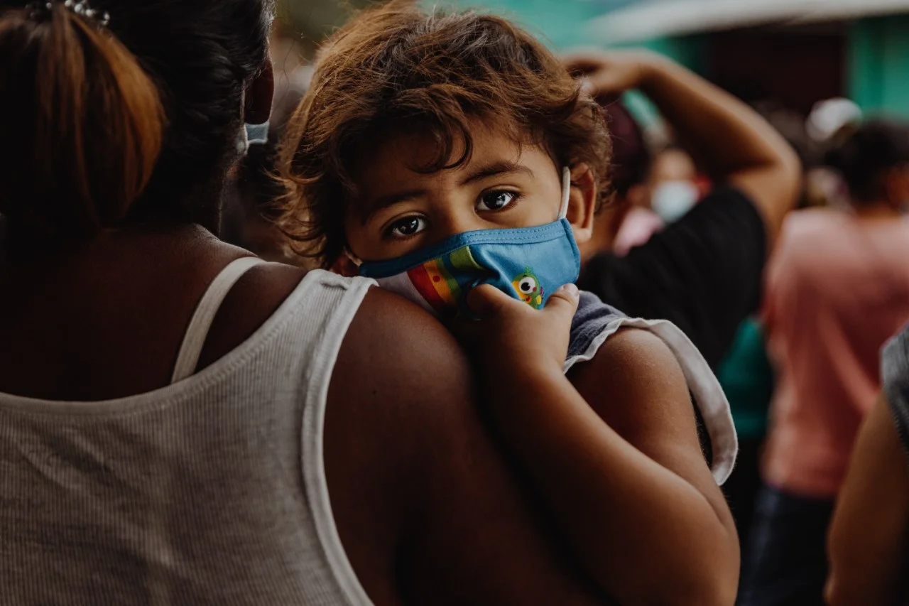 Baby immigrant wearing mask