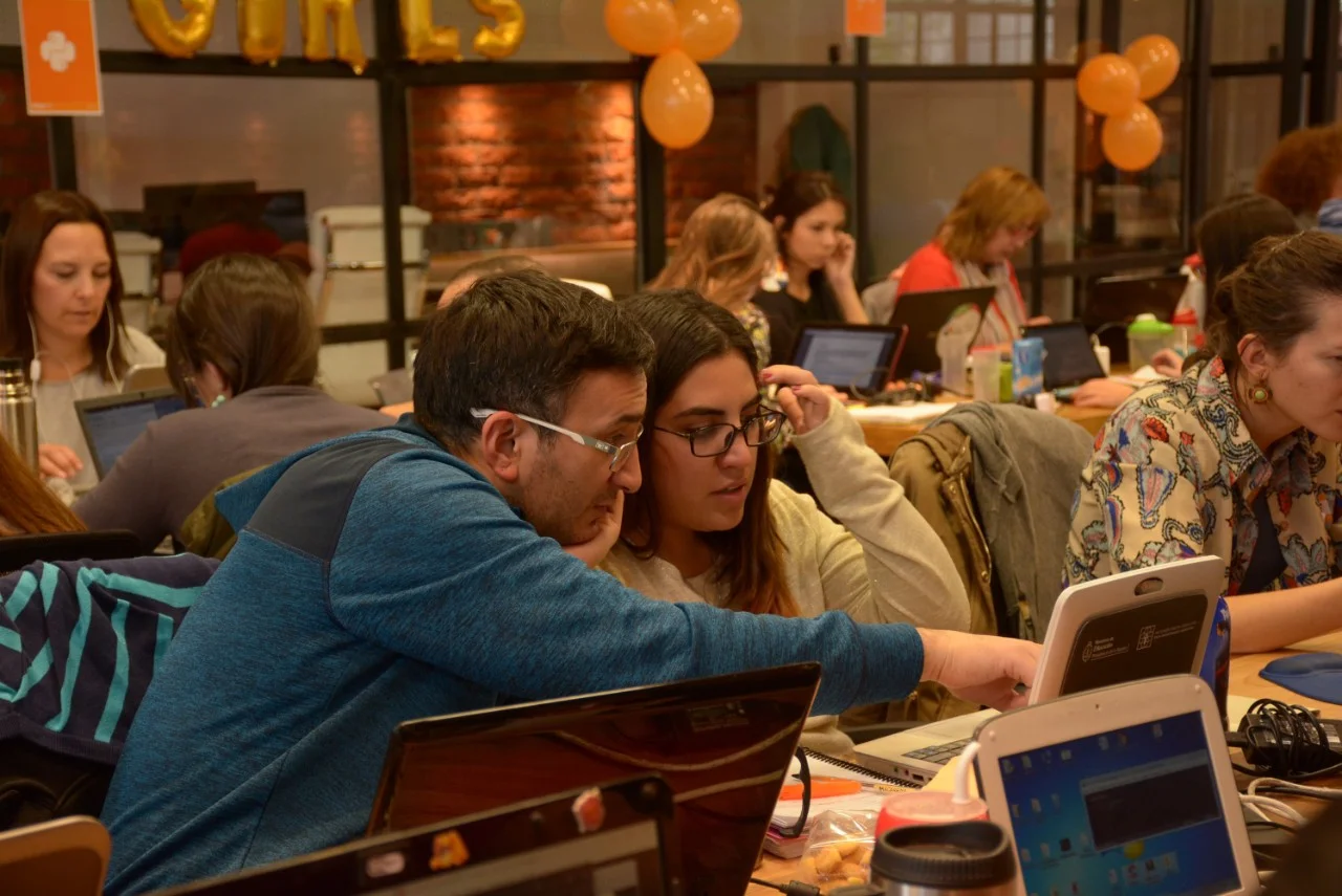 Students using laptops in classroom