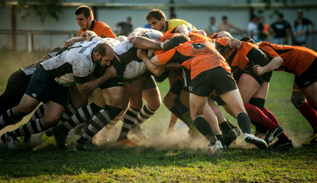 Men playing rugby