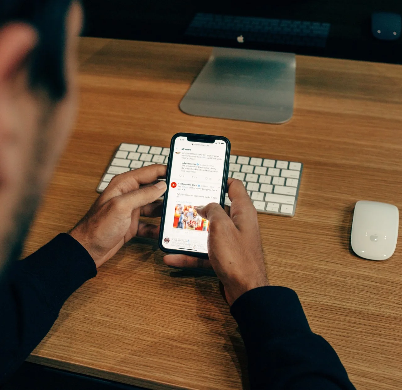 Young man is on phone using social media