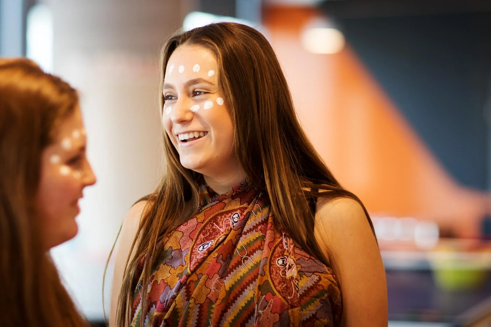Female student smiling in celebration of NAIDOC week