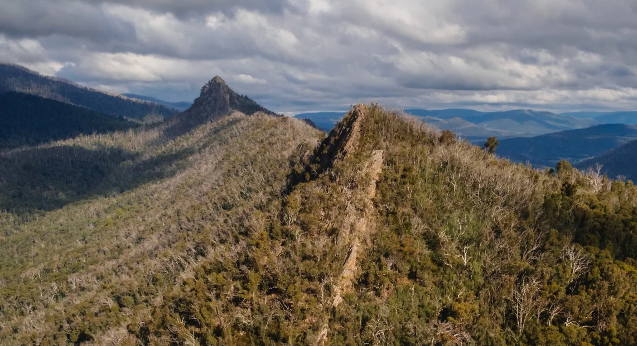 green mountain under cloudy sky
