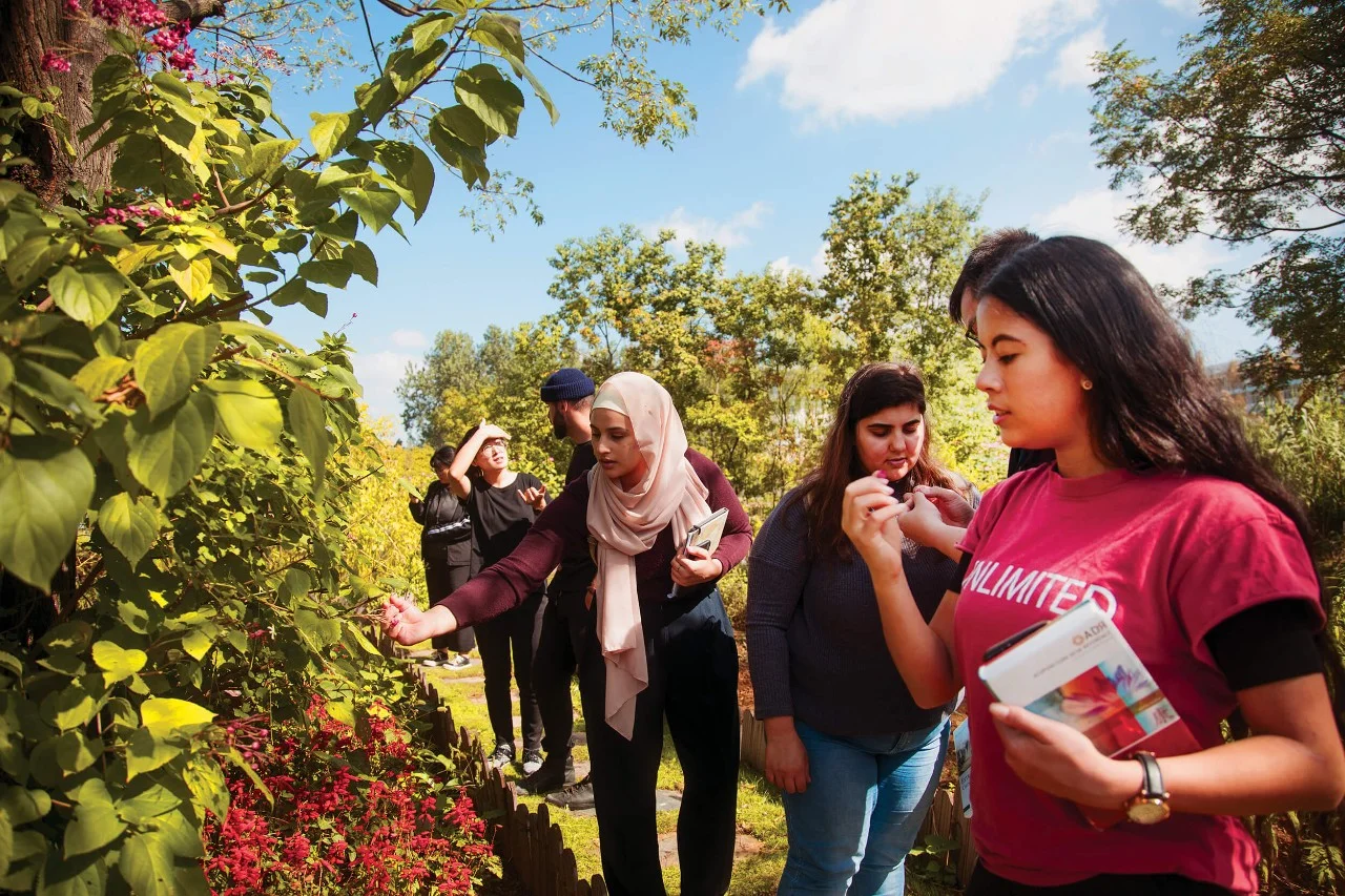 Students outdoors in an orchard