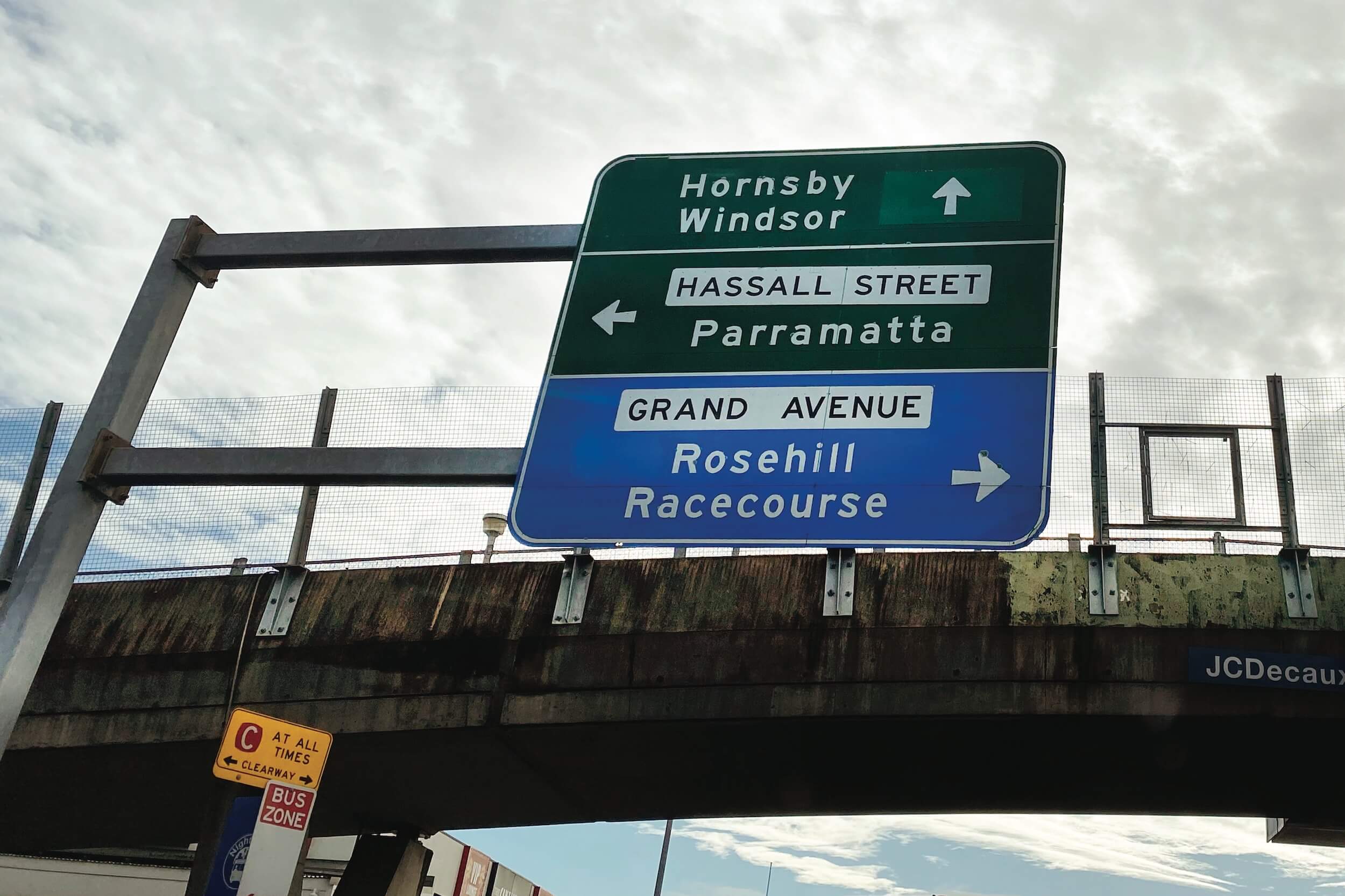 Road signage showing directions to Parramatta CBD and surrounding suburbs