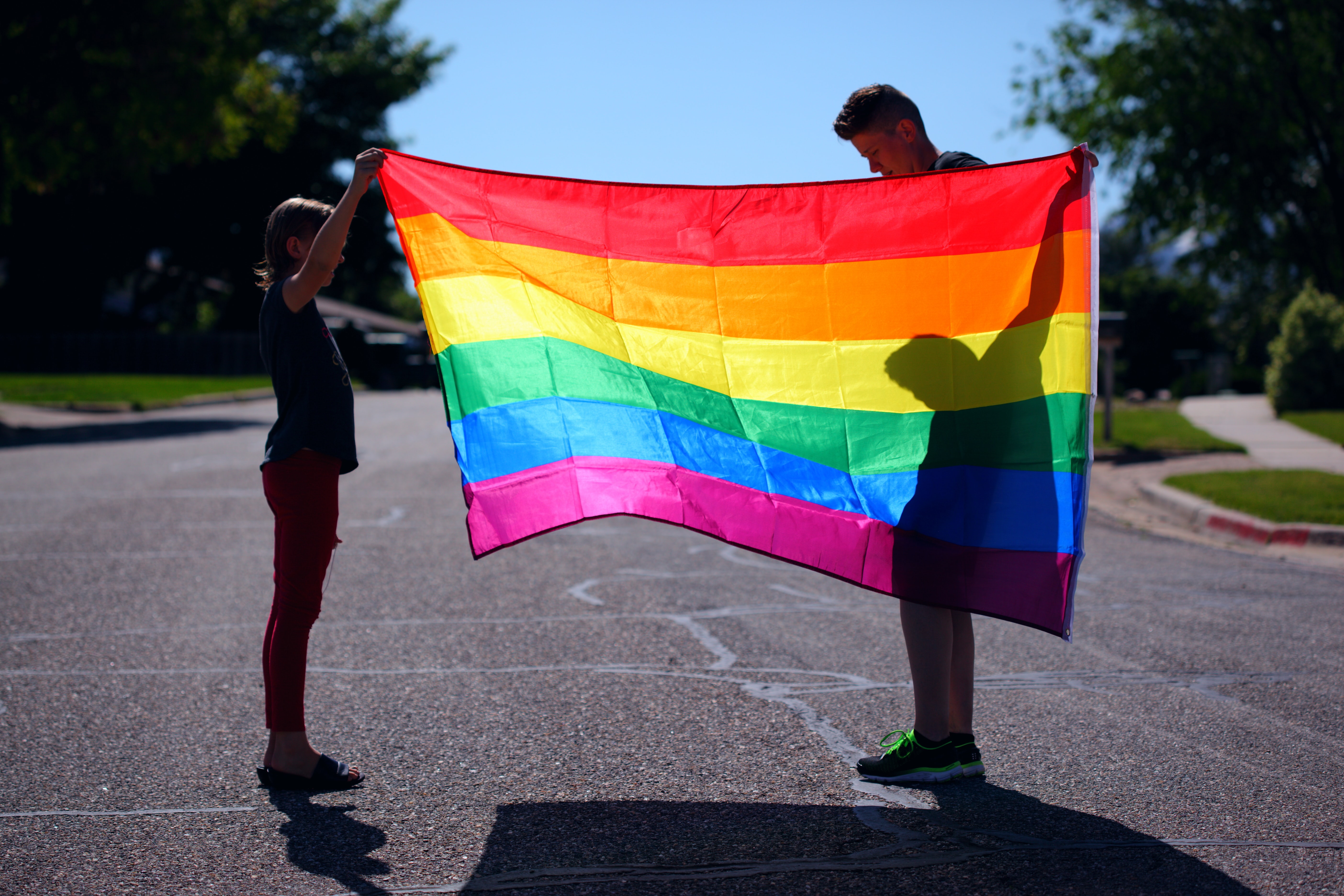 Parent and child with rainbow flag
