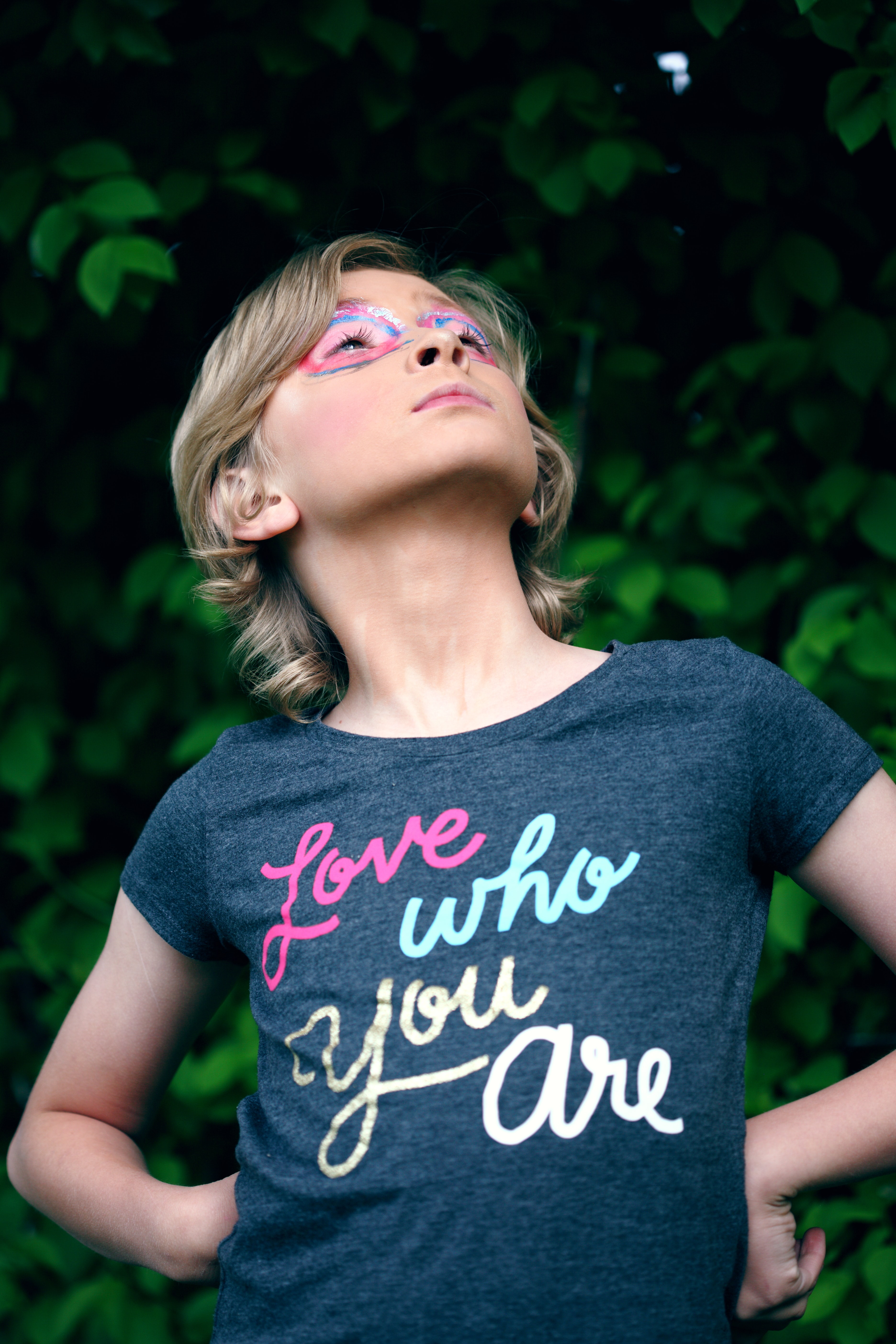 Child in t-shirt that reads love who you are.