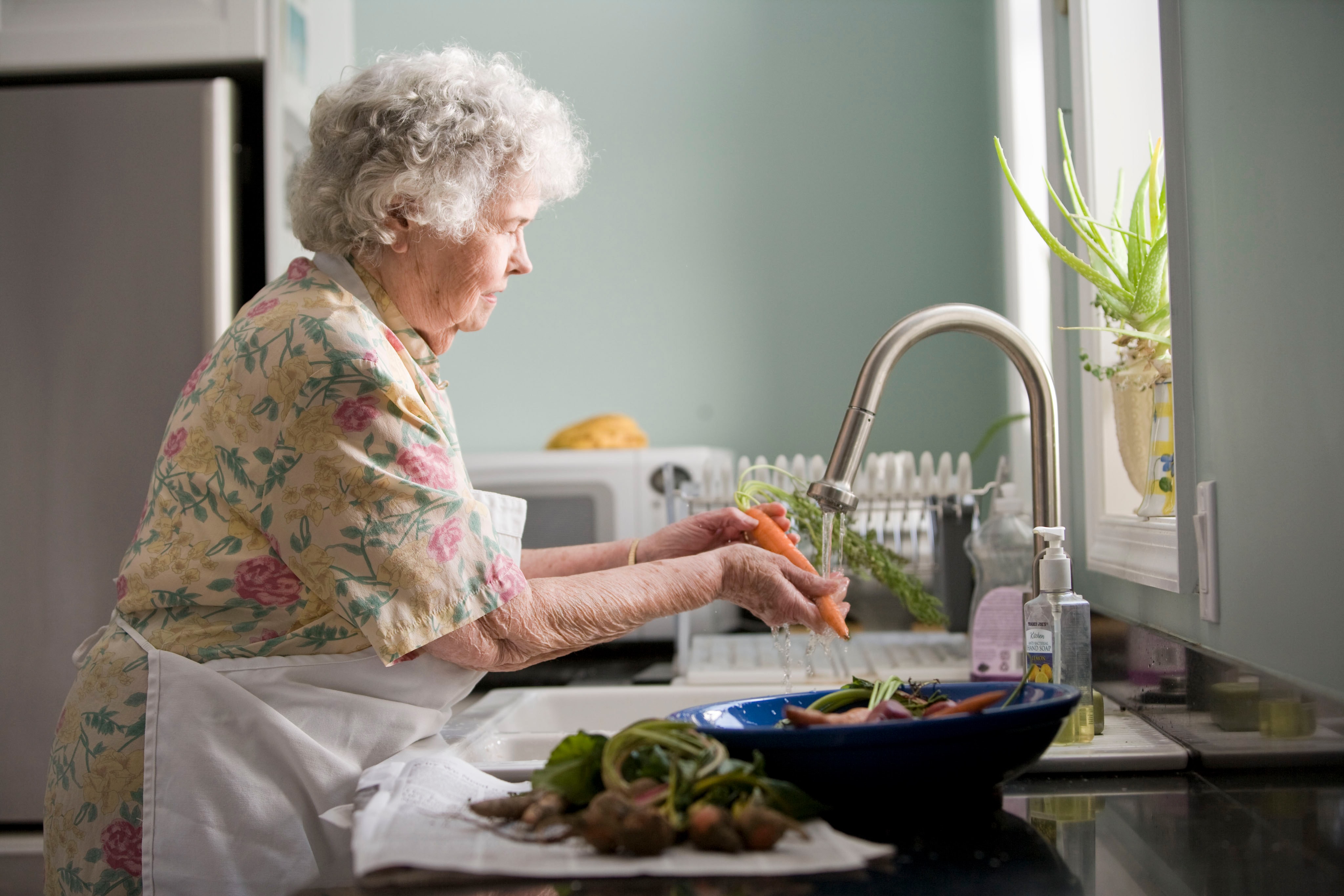 Older woman making food