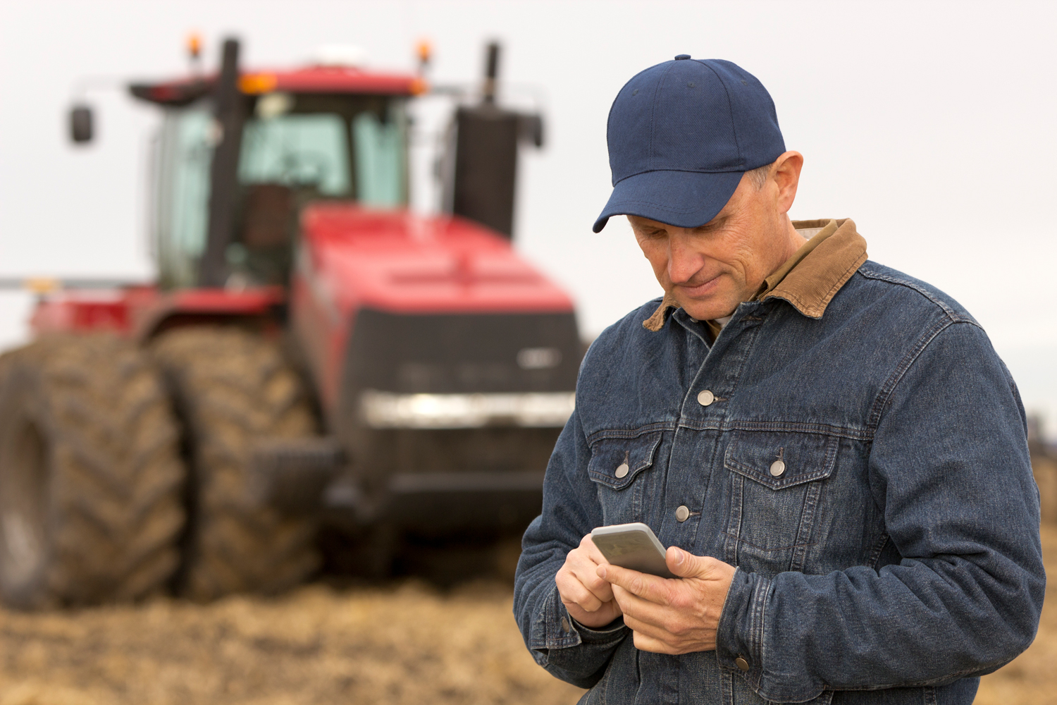 Tractor farmer on the phone