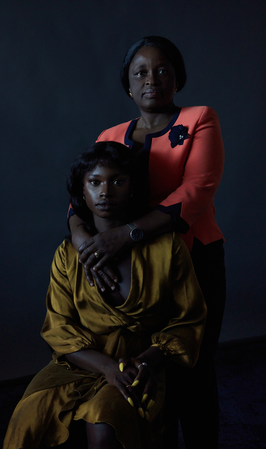 Olayide Ogunsiji (standing) works with spokesperson Fatu Sillah (seated) to increase the resources available to those living with the impacts of female genital mutilation/cutting in Australia.