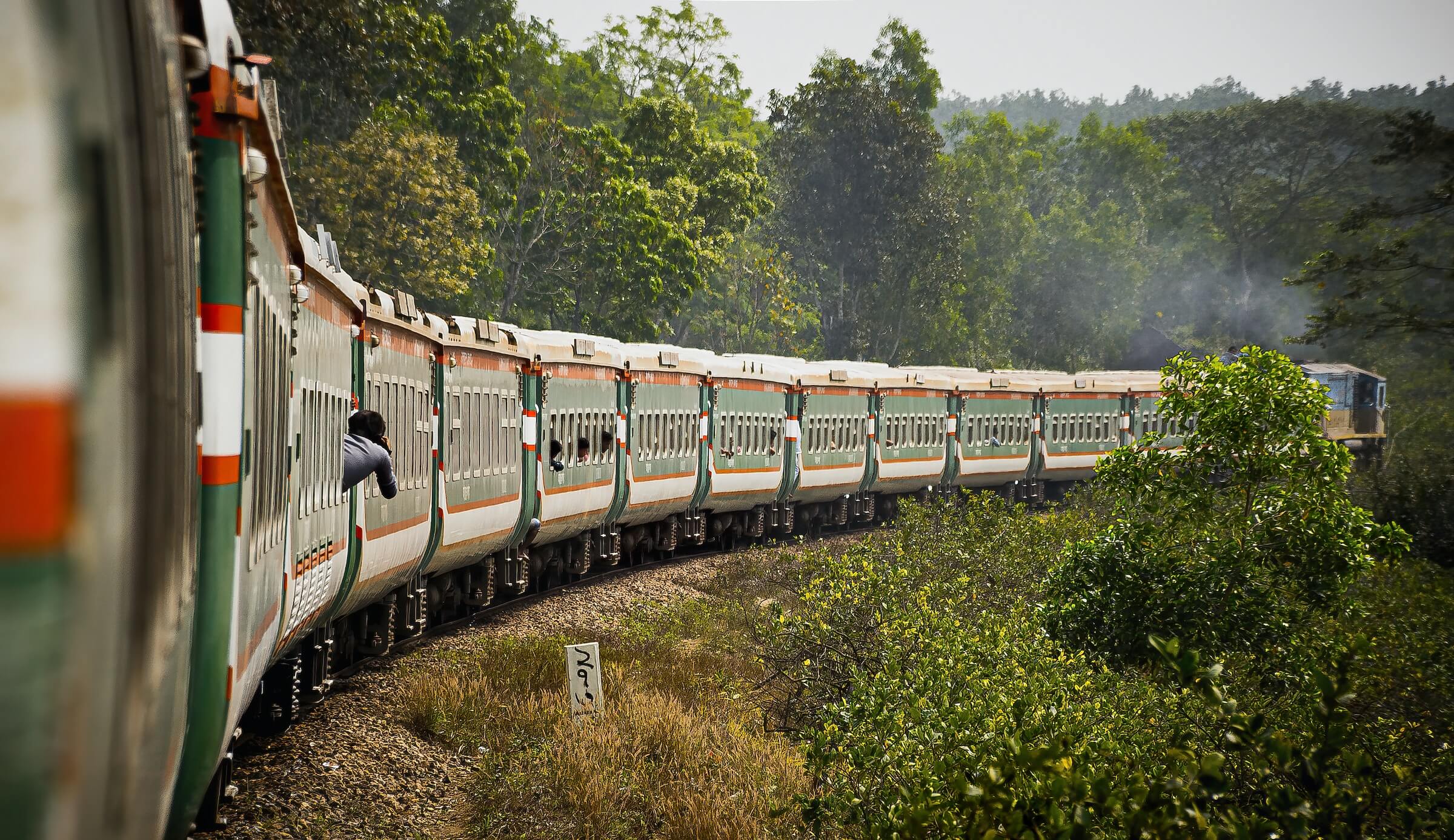 A train travelling through green forest in Sylhet, Bangladesh