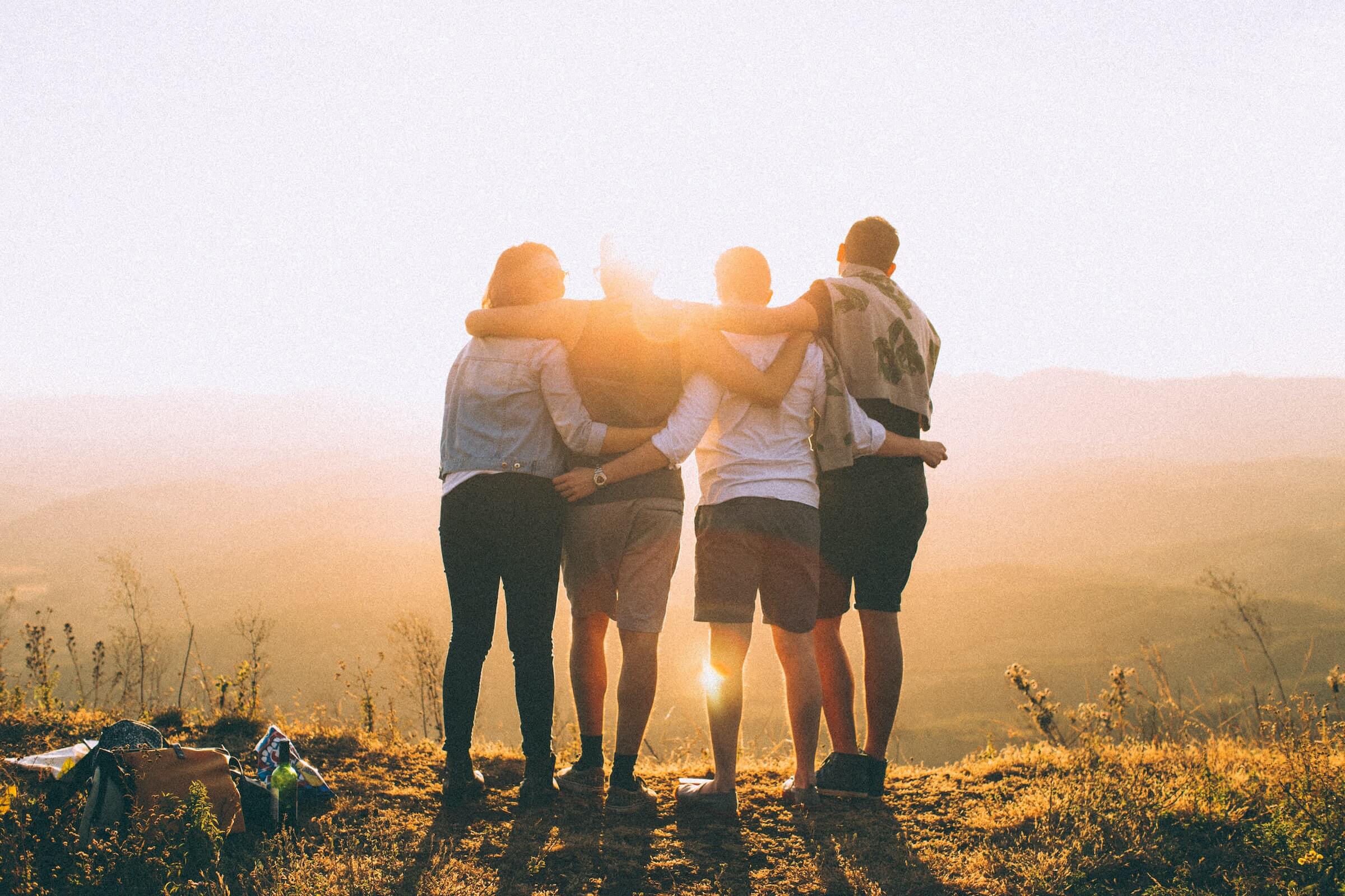 Group of friends watching the sunset