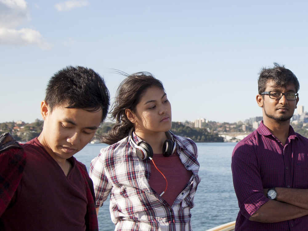 Three Western students outside near Sydney harbour