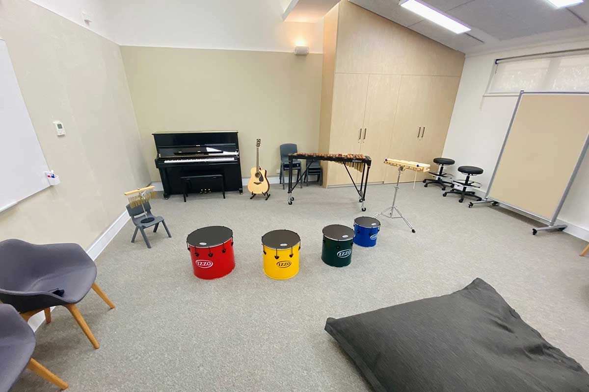 music classroom with instruments and colourful drums