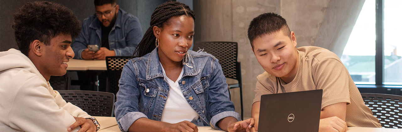 students sitting around a computer
