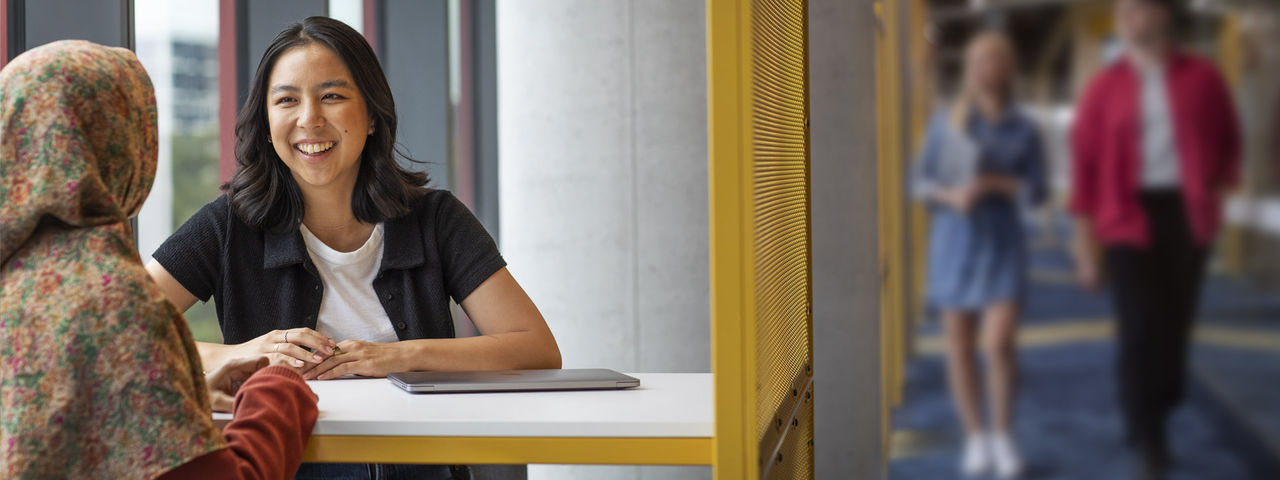 Female student using laptop