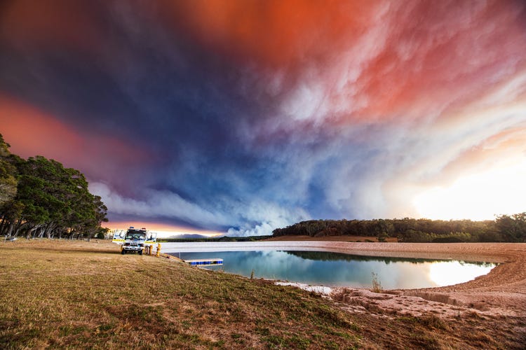 Bushfire smoke reflecting over water