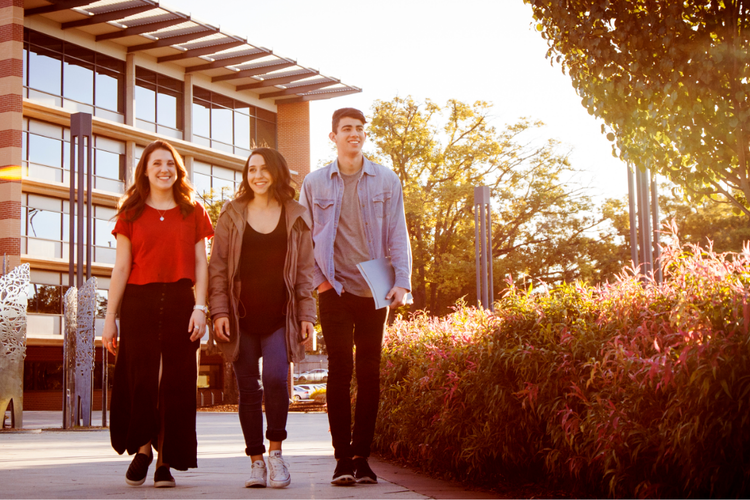 Study with us thumbnail of students walking through a campus.