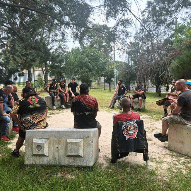 The Shed thumbnail of people gathered in a circle and talking.