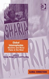 The cover of Global Islamophobia which shows a man holding a sign saying