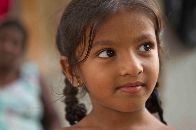 Close up shot of a young girl with pig tails