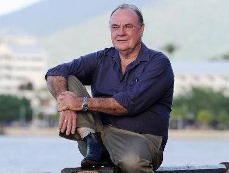 Warren sitting with blurred water in background