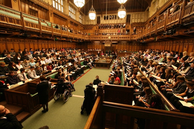 Image of members taking their seats in the House of Commons