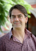 Associate Professor Greg Noble with trees and the Female Orphan School in the background.