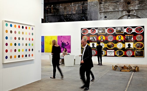 Visitors view art at an art gallery.