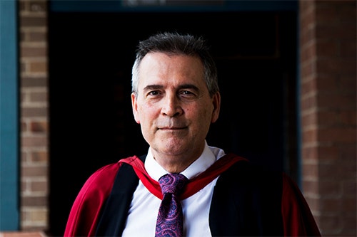 Emeritus Professor David Rowe in graduation regalia