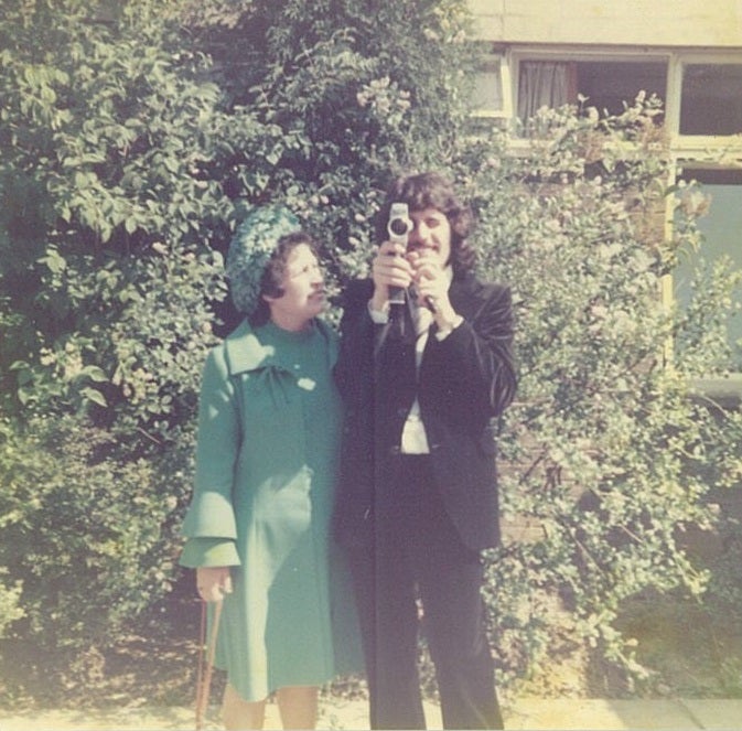 Professor David Rowe holding a camera