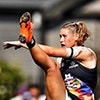 Small cropped image of Tayla Harris kicking a football