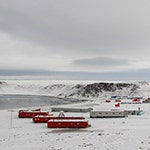 Small image of a base in Antarctica with buildings in the snow