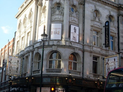 An old theatre building advertising Chariots of Fire.