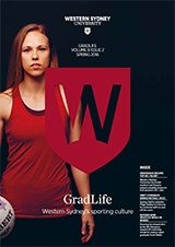 Cover of GradLife magazine featuring a female netballer in red, the red University W shield and a black background.